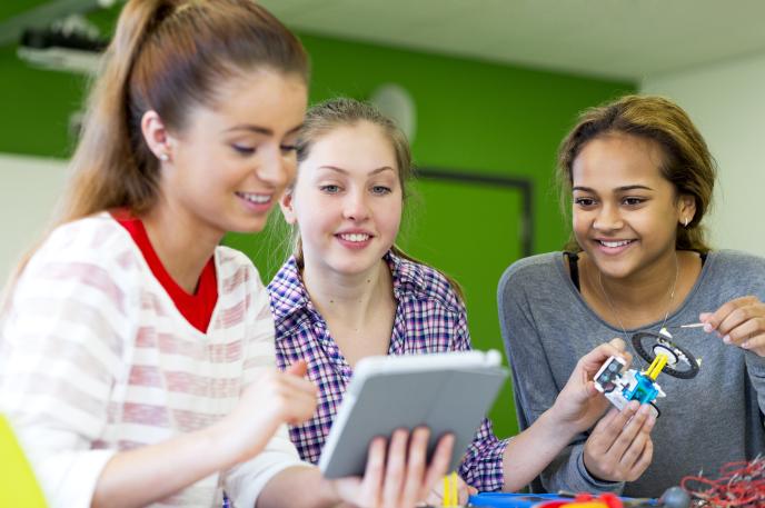 Women looking at Library resources on a tablet Women looking at Library resources on a tablet