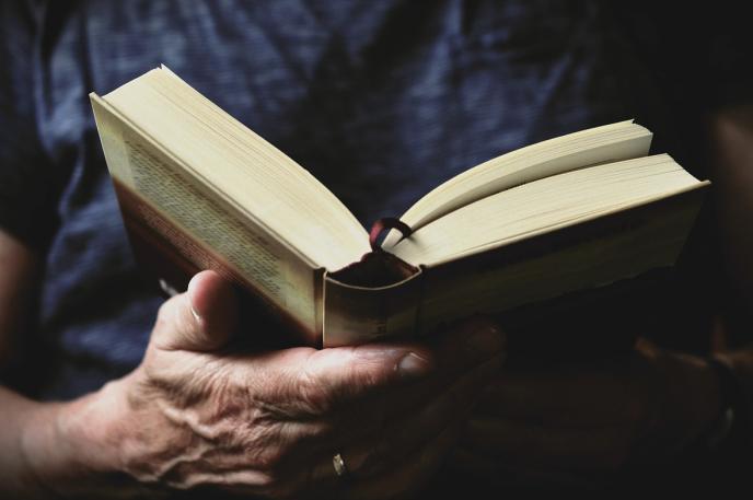 Librarian holding a book