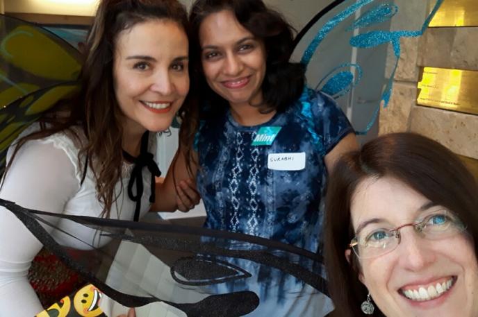 Surabhi Kaushik, Charlotte Mecklenburg Library volunteer, smiles with Iranian Patterson and Pam Turner.