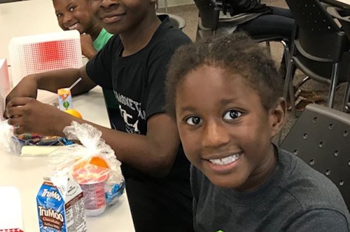 Children enjoy lunch at West Boulevard Library thanks to the Summer Food Service program, a partnership with Charlotte Mecklenburg Schools