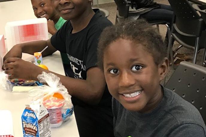 Children enjoy lunch at West Boulevard Library thanks to the Summer Food Service program, a partnership with Charlotte Mecklenburg Schools Children enjoy lunch at West Boulevard Library thanks to the Summer Food Service program, a partnership with Charlotte Mecklenburg Schools